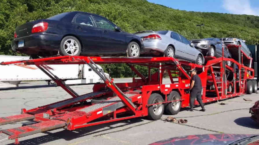 Loading and unloading cars by Viceroy Auto Transport driver